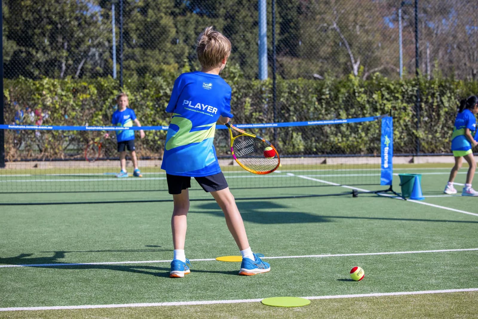 Kids at a holiday tennis clinic