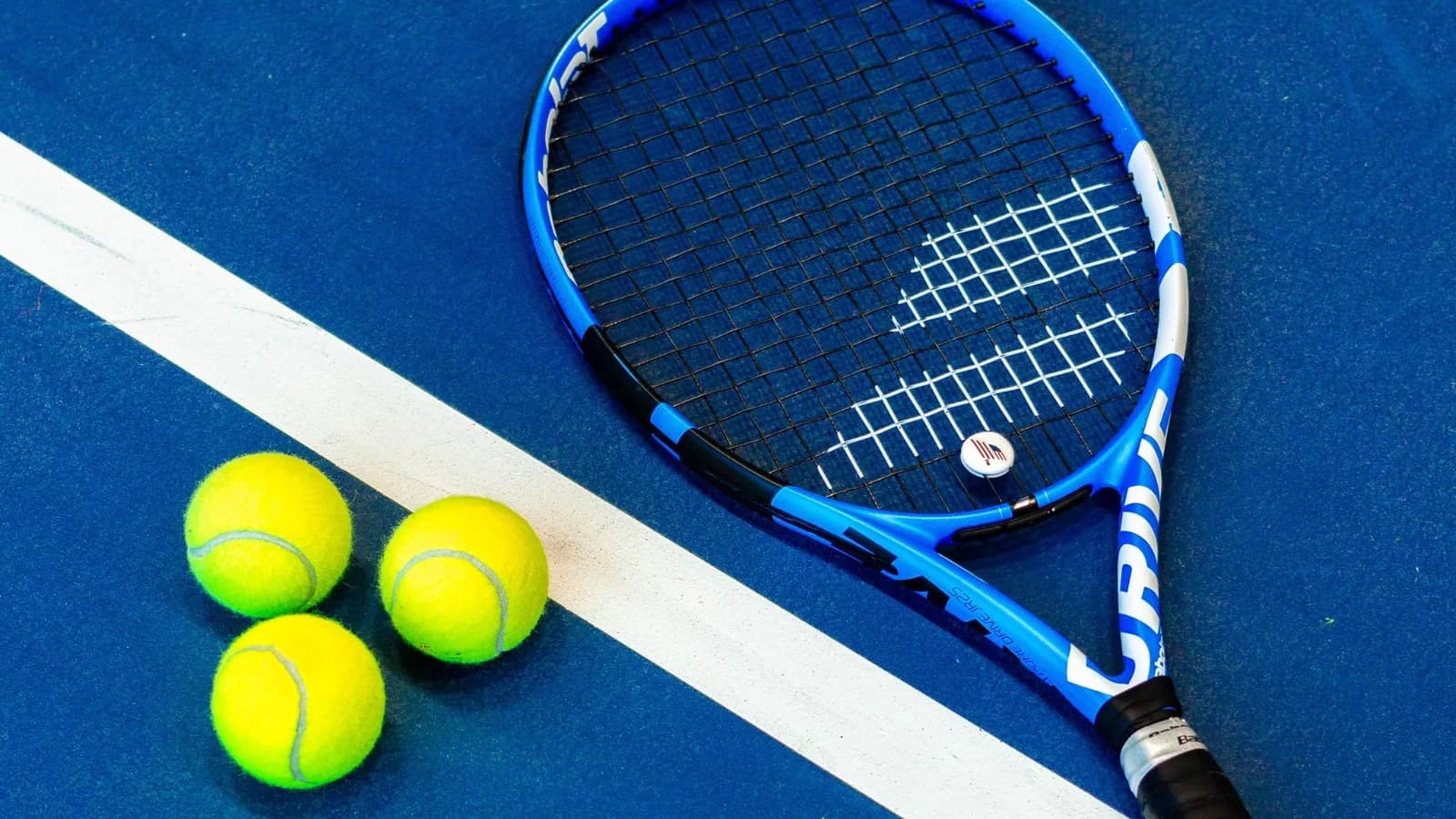 Child holding a junior tennis racquet